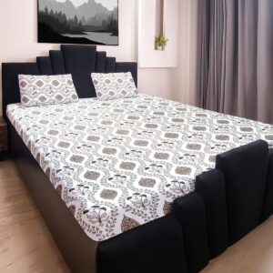 8IbL6qMij2kVc-CGRpthaf3r.jpg King size bedsheet with botanical print and two matching pillow covers on a black bed frame