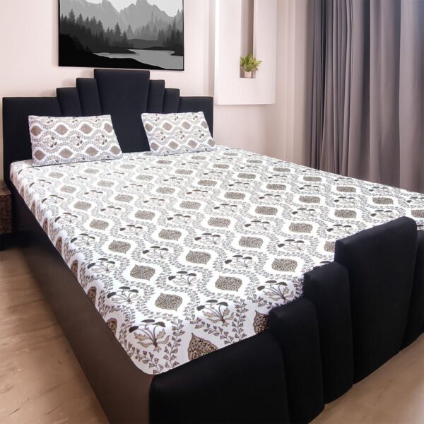 8IbL6qMij2kVc-CGRpthaf3r.jpg King size bedsheet with botanical print and two matching pillow covers on a black bed frame