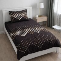 yC2LO4CsvRwI8ET7gvI7OzL1-5.jpg A single bed adorned with a dark brown bedsheet and pillow cover, both featuring a modern pattern of white and brown dots, in a bedroom setting.